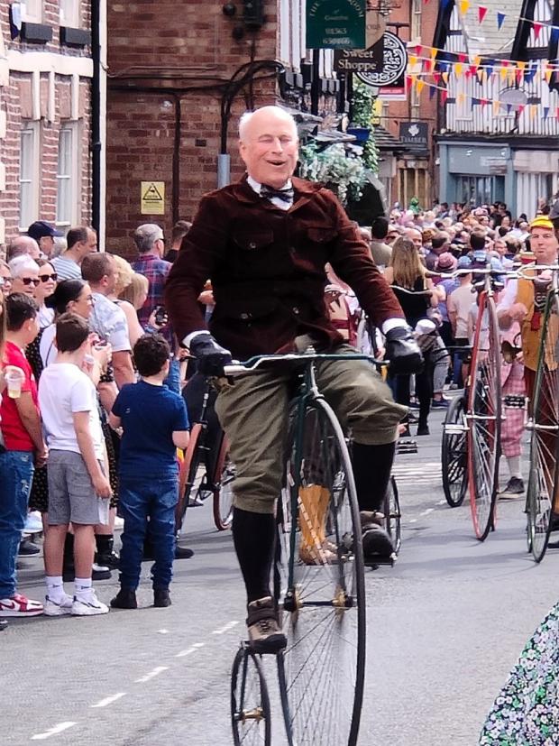 Knutsford Guardian: Men in historic costumes rode antique bikes