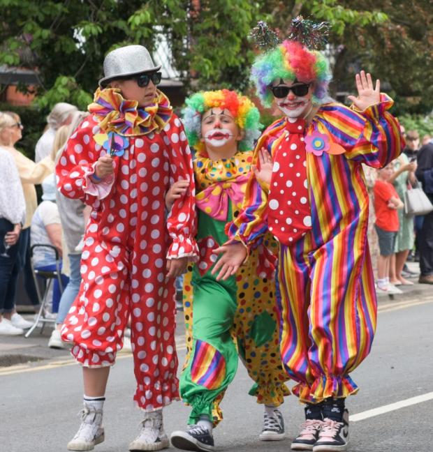 Knutsford Guardian: Comic capers as clowns have fun in the procession Picture: Andy Easthope