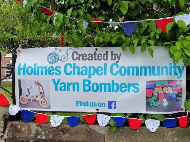 Knutsford Guardian: Holmes Chapel Community Yarn Bombers have decorated the village with knitted bunting
