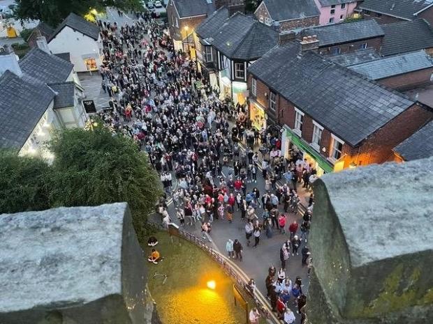 Knutsford Guardian: Crowds gathered in Holmes Chapel to watch a beacon being lit Picture: Karoline Peach