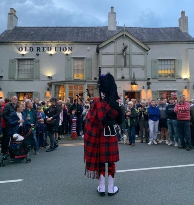 Knutsford Guardian: A bugler heralds the start of the celebrations in Holmes Chapel Picture: Karoline Peach
