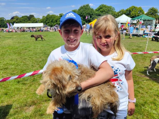 Knutsford Guardian: Oscar and Tillie Clowes with Maggie, who was runner-up in the 'prettiest pooch' competition