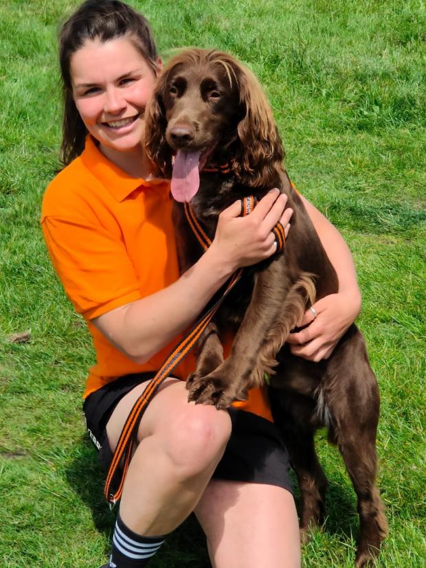 Knutsford Guardian: Naomi Wright with Otto, a working cocker spaniel, who won the 'waggiest tail' competition