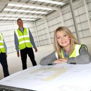Richard Jones, general Manager SpectrumX, Ben Hibbert, operations director and MP Esther McVey at the proposed new manufacturing facility in Knutsford