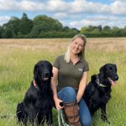 Charlotte Smith at Bark Run with her two retrievers Chance and Whisper