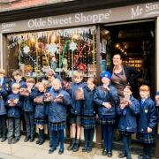 Young entrepreneurs from Yorston Lodge Preparatory School with sweets they plan to sell with help from Julia Chard at Mr Simms Olde Sweet Shoppe
