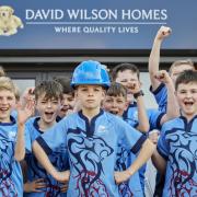 The Wilmslow Wolves under 11s delighted to receive a £1,000 donation from David Wilson Homes to fund their pre-season tour bus
