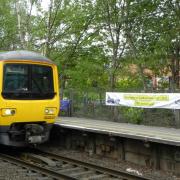 Banners on the platform at Handforth Station celebrate the 180th anniversary of the Manchester to Sandbach railway line