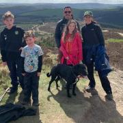 Dylan Peterson, brother Robin, dad Alex, sister Betty, mum Beverley and dog Pepper at the summit of Moel Famau