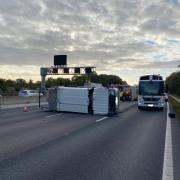 A bin lorry overturned on the M6 northbound after a crash with a stationary Vauxhall Corsa Picture: Cheshire Fire and Rescue Service
