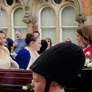 May queen Lily Newall chats to her ladies in waiting as this year's Royal May Day processes through the streets of Knutsford