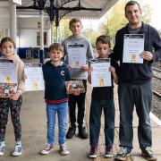 Winners of the Through The Train Window competition, from left, Eliza Bishop, Sam Bishop, Lucas Cronin, Ethan Morgan and David Morgan