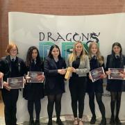 Alderley Edge schoolgirls celebrate with their teachers after winning the Most Innovative Product at Manchester Airport Community Network's Dragon's Den Enterprise Competition 2022