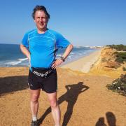 Much-loved Rob McHarry on the beach at Falesia in Portugal, where he enjoyed running holidays with friends