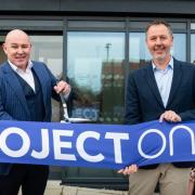 Project One chief executive officer James Sullivan and chairman Paul Clerk open the company's new eco home