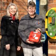 Redrow’s Rachael Reece and Sal Thompson, from the Knutsford Community First Responder Trust, with the defibrillator outside Manchester Road Medical Centre