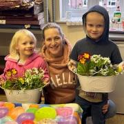Harry Blain, right, and sister Olivia make a flower planter Mother's Day gift for mum Vicky