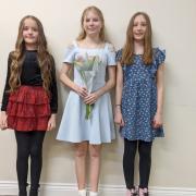 Beth Ralston, centre, this year's Mobberley Rose Queen, with, from left, ladies in waiting Pippa Rowlinson and Rosalie Tarne