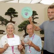 Frances Fieldwick, treasurer, Gerald Sutton, chairman, and Matt Wood, membership secretary, of Cheshire Bonsai Society celebrate after winning a gold medal and best exhibit at last year's RHS Tatton Flower Show.