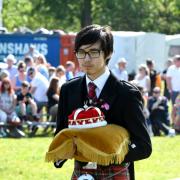 Crown bearer Toby Hui prepares to carry out his ceremonial duties at The Heath