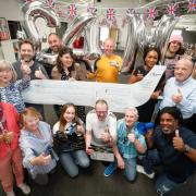 Robert Pattison and Rachel Akili, trustees of Manchester Airport Community Trust Fund celebrate £4 million worth of donations with the  team behind Silver Screen Dreams, who received £1,500