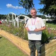 Callum Corrie proud to win a gold medal  for his long border entitled 'Picture Perfect' at the RHS Tatton Flower Show