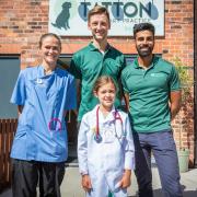 Eliza Bishop with veterinary student Esme Perry and Tatton Vets' founders Christian Sadler and Riaz Rhemu