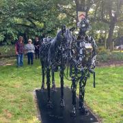 Tom Hill's sculpture depicts the moving scene at Queen Elizabeth II's funeral as Emma and Terry looked on