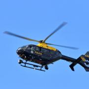A police helicopter has been searching all night for a missing woman from  Goostrey