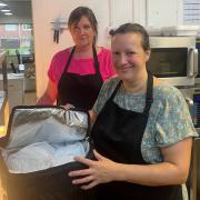 Fiona Halford and Suzanne Tamsarei preparing Meals on Wheels at The Welcome