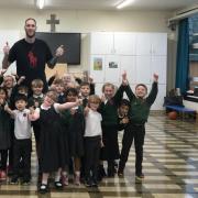 Paul Sturgess, the tallest man in Britain, visited St Vincent de Paul Catholic Primary School