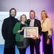 Booths licensed category buying manager Simon Drury, holding the award, with, from left, MC Matt White, Charlotte Wallace, Oakley Wine Agencies and Kate Goodman, awards co-presenter and owner of Reserve Wines