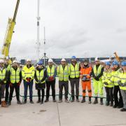 Manchester Airport's team and Mace and  Martifer in front of some of the new steelworks