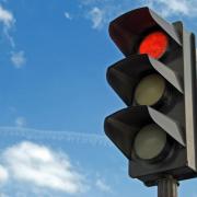 A Wilmslow drover caught jumping a red traffic light has been hit with a £800 court penalty