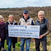 From left, Helen Battilana, Georgie Johnson, Town Mayor Cllr Jon Newell and John Handley donate a community grant of £12,945 to Discover Lindow
