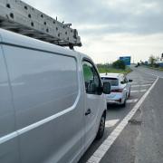 The driver of this van was spotted by police holding a mobile phone to his left ear with a cigarette in his right hand