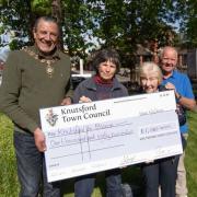 Outgoing mayor Cllr Peter Coan presents a grant to members of Knutsford in Bloom