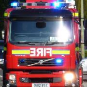 A building was evacuated after a fire broke out in a toilet at commercial premises in Holmes Chapel